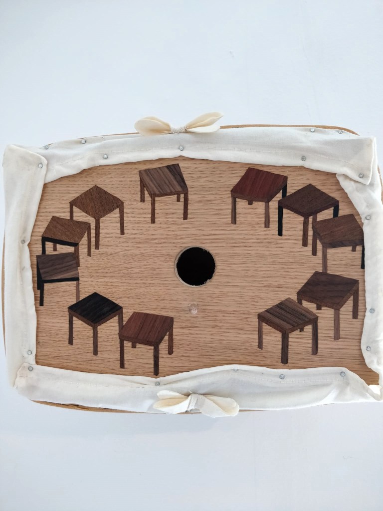 Post or Pre AA Meeting by Jay Potrykus, handmade bird box, 2024, mixed wood, cloth, wax, found basket, nails